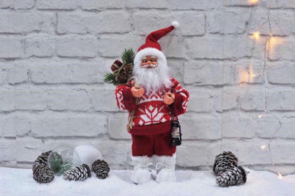 Picture of FESTIVE MAGIC SANTA HOLDS LANTERN 30CM